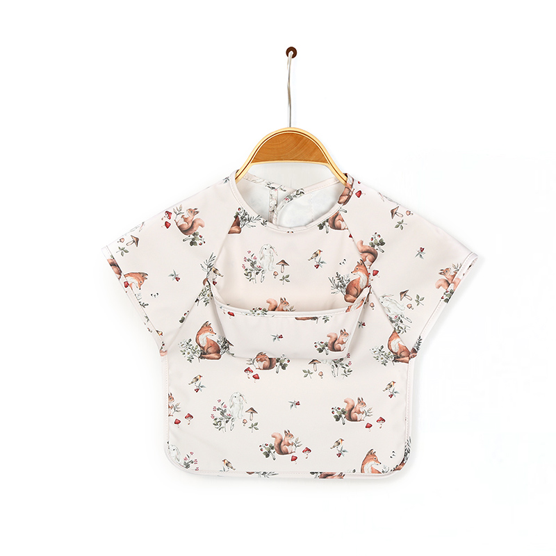 Babero de delantal de PU de manga corta con diseño de bolsillo para bebés
