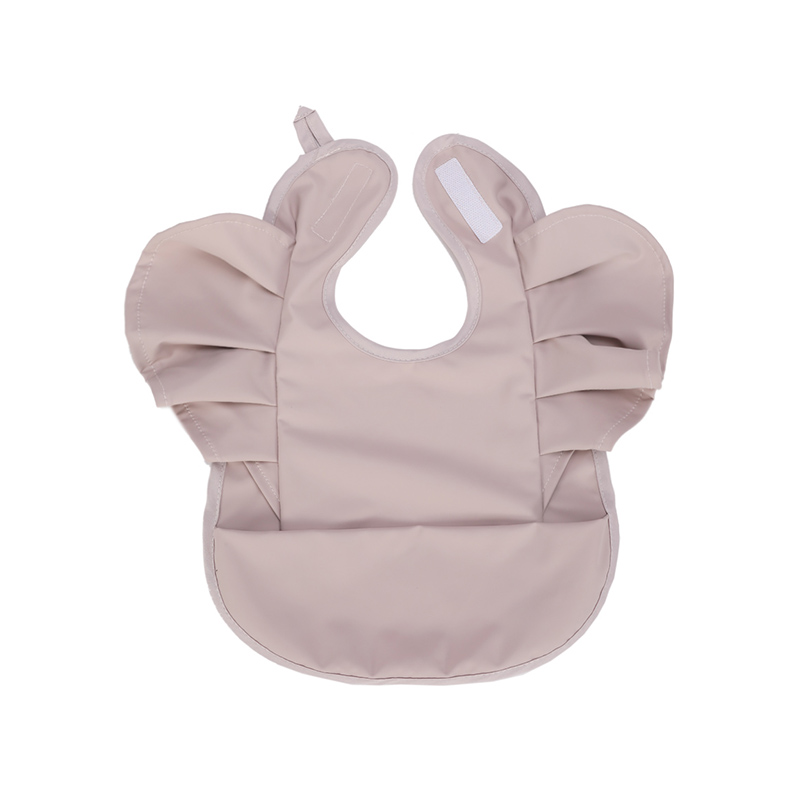 Babero de PU premium con diseño de volantes
